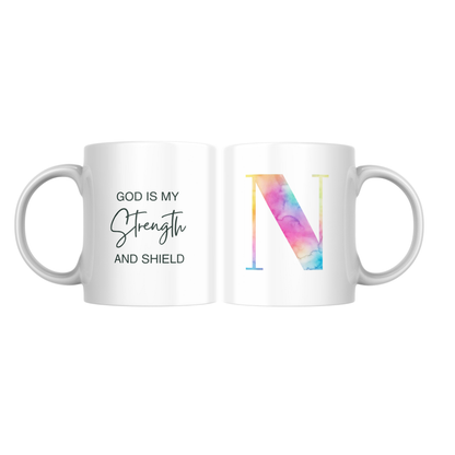 A sublimated mug with an initial on one side and scripture on the other