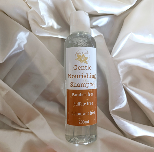 Goddess Creativity Gentle Nourishing Shampoo – paraben-free, sulfate-free, and colourant-free formula in a 200ml clear bottle, photographed on silky cream fabric.