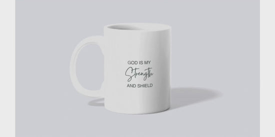 A video of sublimated mug with an initial on one side and scripture on the other