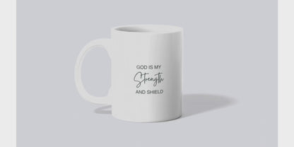 A video of sublimated mug with an initial on one side and scripture on the other