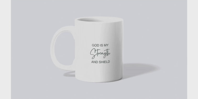 A video of sublimated mug with an initial on one side and scripture on the other